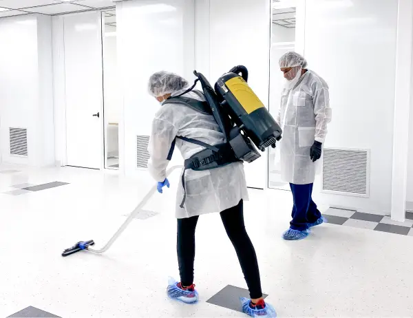 Moreno employees cleaning inside a clean room facility