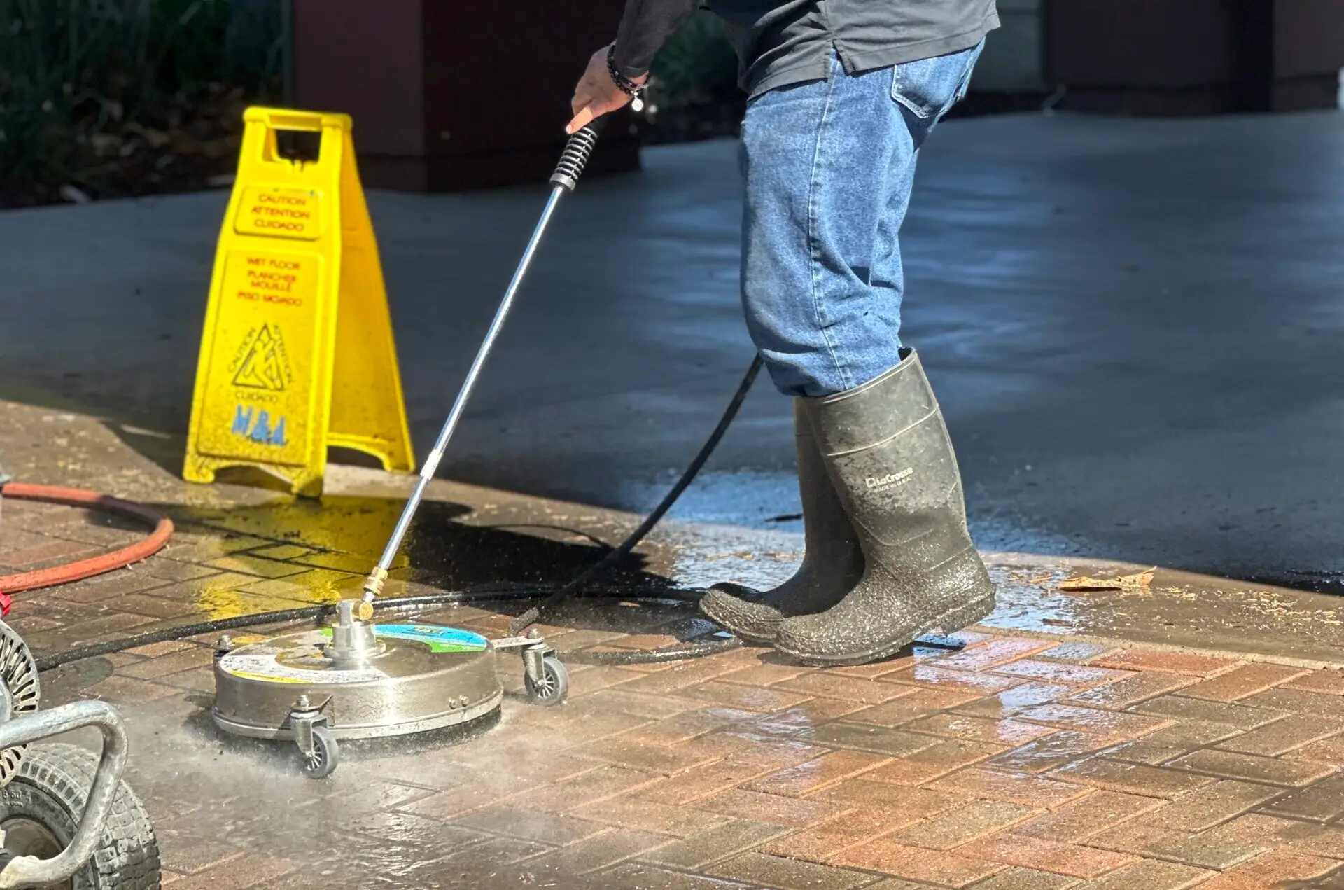 moreno employee pressure washing concrete